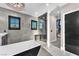 Sleek bathroom featuring a soaking tub, walk-in glass shower, and dark fixtures adding modern style at 387 Hoskins Ct, Henderson, NV 89012