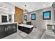 Elegant bathroom showcasing double vanities, a soaking tub, and walk-in shower in a well-lit space at 387 Hoskins Ct, Henderson, NV 89012