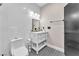 Stylish bathroom featuring white subway tile, patterned flooring, and modern vanity at 387 Hoskins Ct, Henderson, NV 89012
