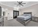 Bedroom with a ceiling fan, neutral walls, carpet, and closet with dark-colored sliding doors at 387 Hoskins Ct, Henderson, NV 89012