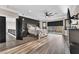 Beautiful bedroom with hardwood floors, a dark accent wall, large windows and private balcony access at 387 Hoskins Ct, Henderson, NV 89012