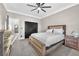 Bedroom with a ceiling fan, neutral walls, carpet, and closet with dark-colored sliding doors at 387 Hoskins Ct, Henderson, NV 89012