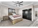 Bedroom with a ceiling fan, neutral walls, carpet, and closet with dark-colored sliding doors at 387 Hoskins Ct, Henderson, NV 89012