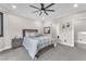 Neutral bedroom showcasing a comfortable bed, soft carpet, and a view into the hallway at 387 Hoskins Ct, Henderson, NV 89012