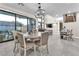 Dining room features large windows, modern lighting, and an open floor plan at 387 Hoskins Ct, Henderson, NV 89012