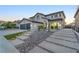 Stunning two-story home featuring a tile roof, desert landscaping, and a modern driveway design at 387 Hoskins Ct, Henderson, NV 89012