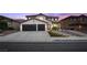 Charming two-story home with a two-car garage and desert landscaping for modern curb appeal at 387 Hoskins Ct, Henderson, NV 89012