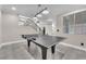 Game room with ping pong table, statement staircase and large windows, perfect for entertaining at 387 Hoskins Ct, Henderson, NV 89012