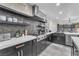 Gourmet kitchen with stainless steel appliances, custom backsplash, and stone countertops at 387 Hoskins Ct, Henderson, NV 89012