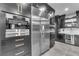 Modern kitchen featuring stainless steel appliances, custom cabinetry, and ample counter space at 387 Hoskins Ct, Henderson, NV 89012