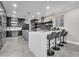 Well-equipped kitchen features bar seating, stainless steel appliances, and modern finishes at 387 Hoskins Ct, Henderson, NV 89012