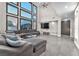 Open living room boasts high ceilings, large windows, and a comfortable seating area at 387 Hoskins Ct, Henderson, NV 89012