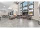 Bright living room featuring large windows, high ceilings, and an open floor plan at 387 Hoskins Ct, Henderson, NV 89012
