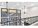 Second floor with railings, decorative windows, and scenic views, offering a unique living space at 387 Hoskins Ct, Henderson, NV 89012
