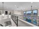 Second floor featuring decorative railings, abundant natural light, and stylish fixtures at 387 Hoskins Ct, Henderson, NV 89012