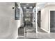 Contemporary glass enclosed shower with patterned tile and seating in a modern bathroom setting at 387 Hoskins Ct, Henderson, NV 89012