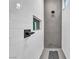 Modern shower featuring gray honeycomb tile and a built-in niche for bath products at 387 Hoskins Ct, Henderson, NV 89012