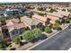 Aerial shot of a residential neighborhood showcasing well-maintained homes with tile roofs and desert landscaping at 4351 Hera Temple Ave, North Las Vegas, NV 89031