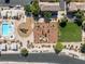 Bird's-eye view of community park featuring a pool, playground, small field, and seating areas with shade coverings at 4351 Hera Temple Ave, North Las Vegas, NV 89031