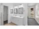 Bright bathroom features a double sink vanity and walk-in closet at 4351 Hera Temple Ave, North Las Vegas, NV 89031