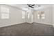 Large bedroom with carpet, ceiling fan and access to a private balcony at 4351 Hera Temple Ave, North Las Vegas, NV 89031