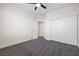 Carpeted bedroom with a ceiling fan and closet for ample storage at 4351 Hera Temple Ave, North Las Vegas, NV 89031