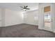 Bedroom featuring carpet, a ceiling fan, and a balcony with outdoor access at 4351 Hera Temple Ave, North Las Vegas, NV 89031