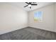 Neutral bedroom with carpet, ceiling fan, and a window offering natural light at 4351 Hera Temple Ave, North Las Vegas, NV 89031