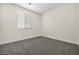 Neutral bedroom with a gray carpet and window at 4351 Hera Temple Ave, North Las Vegas, NV 89031