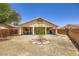 Wide view of backyard featuring gravel landscaping and a covered patio at 4361 Valley Quail Way, North Las Vegas, NV 89084