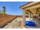 Spacious backyard featuring a patio and low-maintenance gravel landscaping at 4361 Valley Quail Way, North Las Vegas, NV 89084