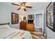Cozy bedroom with ceiling fan, featuring laminate flooring, and themed decor at 4361 Valley Quail Way, North Las Vegas, NV 89084