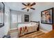 Cozy bedroom featuring hardwood floors, posters and good light at 4361 Valley Quail Way, North Las Vegas, NV 89084