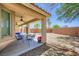 Charming covered patio with a dining table and spacious backyard view at 4361 Valley Quail Way, North Las Vegas, NV 89084