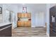 Functional kitchen with wood cabinets, stainless appliances, and wood floors offering great storage and prep space at 4361 Valley Quail Way, North Las Vegas, NV 89084