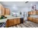 Bright kitchen featuring wooden cabinets, sleek appliances, and stylish decor at 4361 Valley Quail Way, North Las Vegas, NV 89084