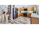 Well-equipped kitchen with stainless steel appliances, wooden cabinets, and open layout at 4361 Valley Quail Way, North Las Vegas, NV 89084