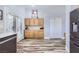 Spacious kitchen with wooden cabinets, a door to the outside, and modern appliances at 4361 Valley Quail Way, North Las Vegas, NV 89084