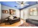 Comfortable living room area with a gray sofa, french doors and a patterned rug at 4361 Valley Quail Way, North Las Vegas, NV 89084