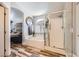 Bright bathroom featuring a shower, soaking tub, natural light from a window, and modern fixtures at 4361 Valley Quail Way, North Las Vegas, NV 89084