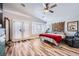 Bright main bedroom features a ceiling fan, a bay window seat, and access to a private patio at 4361 Valley Quail Way, North Las Vegas, NV 89084
