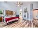 Spacious main bedroom with ceiling fan, unique decor, and a walk-in archway leading to the main bath at 4361 Valley Quail Way, North Las Vegas, NV 89084