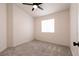 Comfortable bedroom featuring a ceiling fan, window, and plush carpeting, perfect for relaxing and unwinding at 4825 White Aspen Ave, Las Vegas, NV 89130
