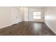 Bright living room boasting fresh paint, modern flooring, and ample natural light at 4825 White Aspen Ave, Las Vegas, NV 89130