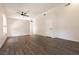 Open living room with modern floors, a ceiling fan, and fresh white walls at 4825 White Aspen Ave, Las Vegas, NV 89130