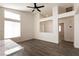 Open concept living space featuring modern floors, recessed lighting, and a convenient pass-through at 4825 White Aspen Ave, Las Vegas, NV 89130