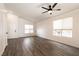 Spacious living room featuring vaulted ceilings, modern flooring, and large windows at 4825 White Aspen Ave, Las Vegas, NV 89130