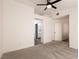 Large bedroom with a ceiling fan, en suite bathroom, and a walk-in closet for ample storage space at 4825 White Aspen Ave, Las Vegas, NV 89130