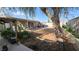 Large backyard with covered patio and lush landscaping, offering a serene outdoor space at 5209 Del Monte Ave, Las Vegas, NV 89146