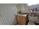 Bathroom featuring a vanity, toilet and door leading to another room at 5209 Del Monte Ave, Las Vegas, NV 89146